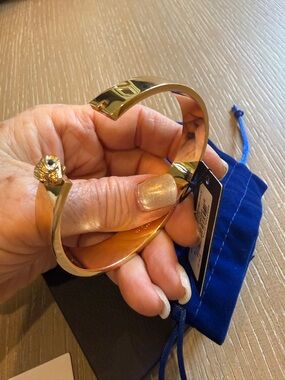 Kurt Geiger Gold Plated Hinged Bangle with Logo Charm, brand new, 8”